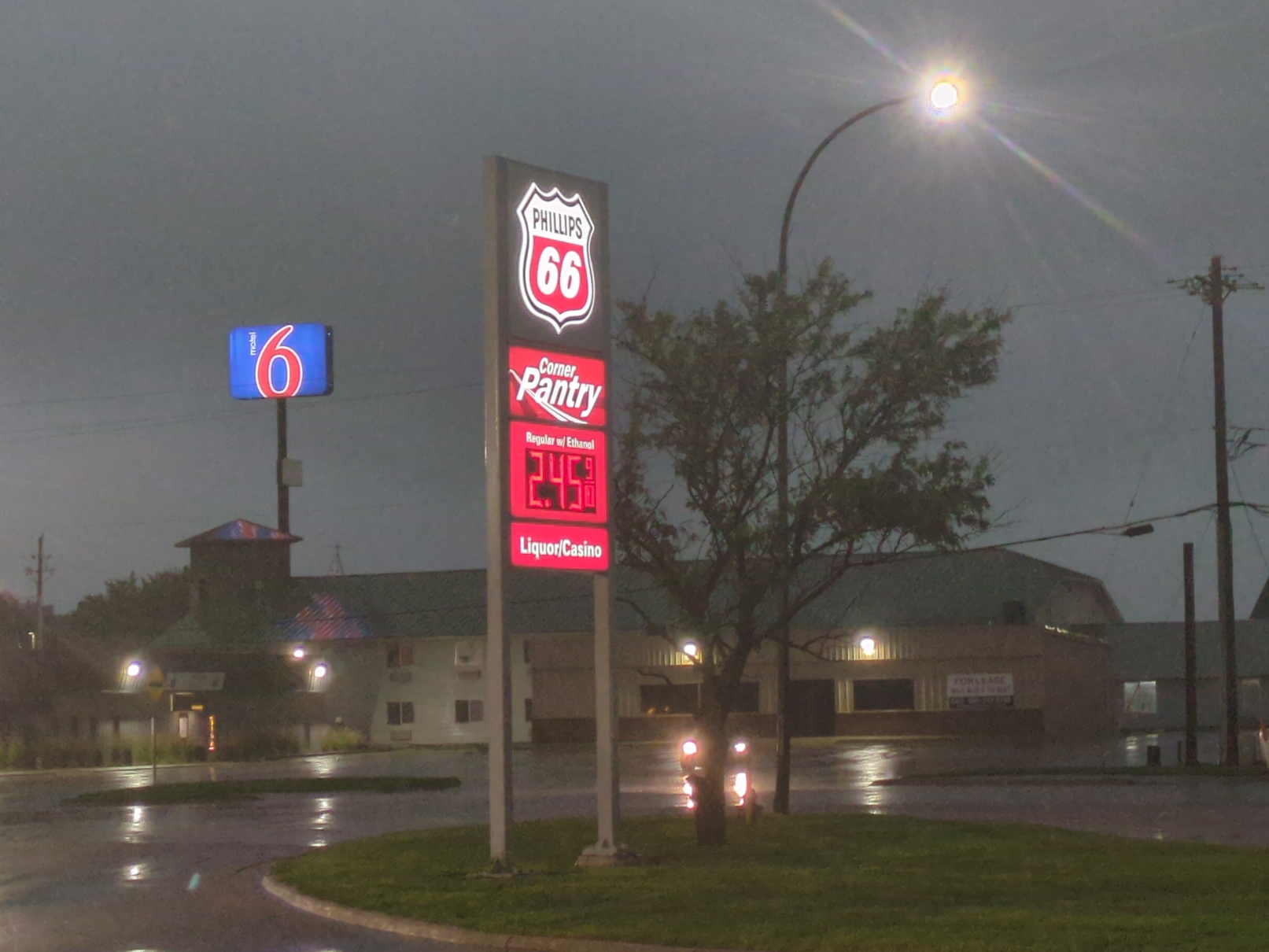 Philips gas sign displaying $2.45 per gallon